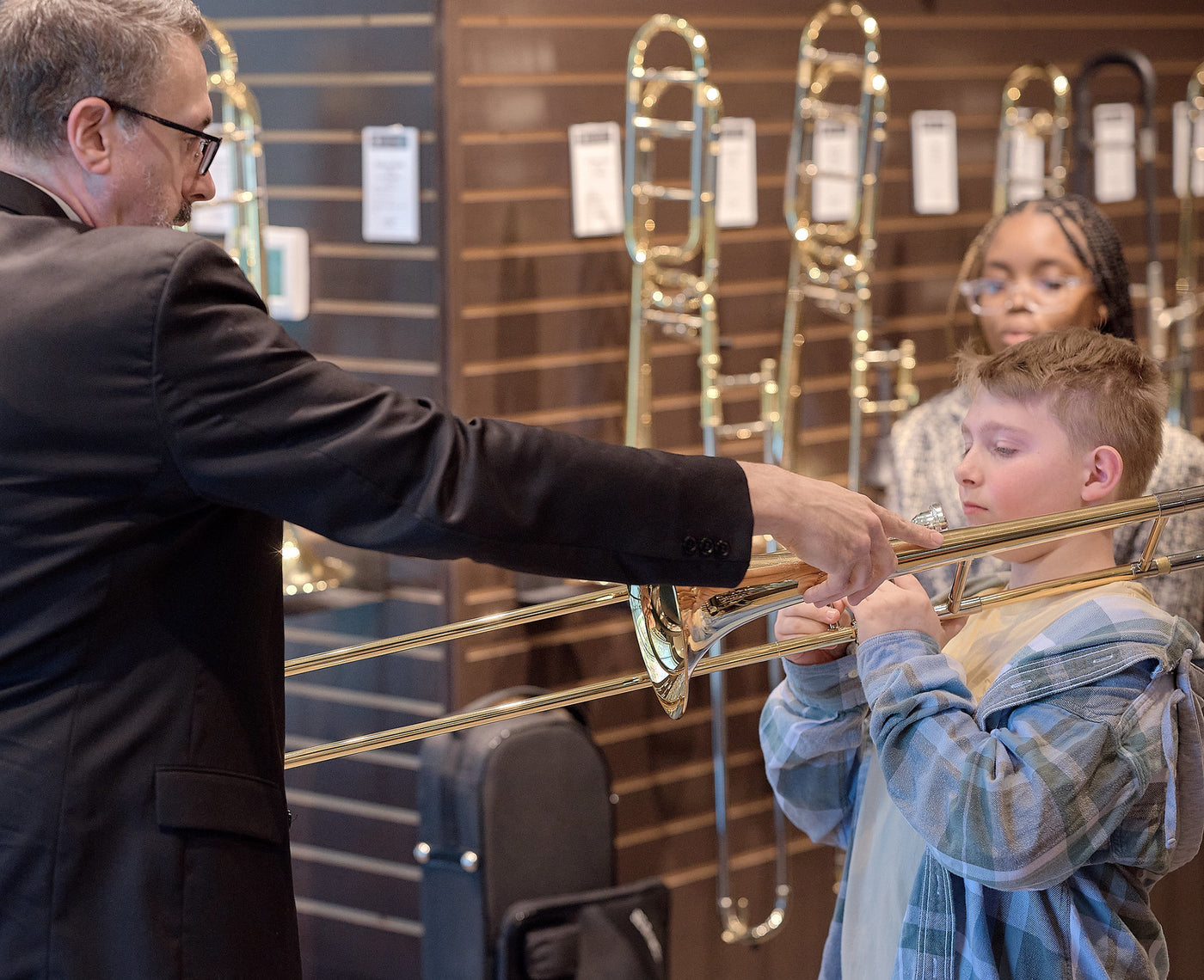 Child learning to play trombone