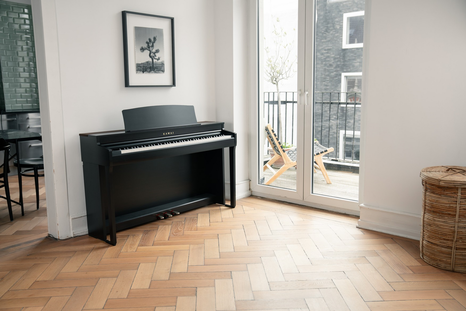 Kawai digital piano in a room with wooden flooring and a large window.