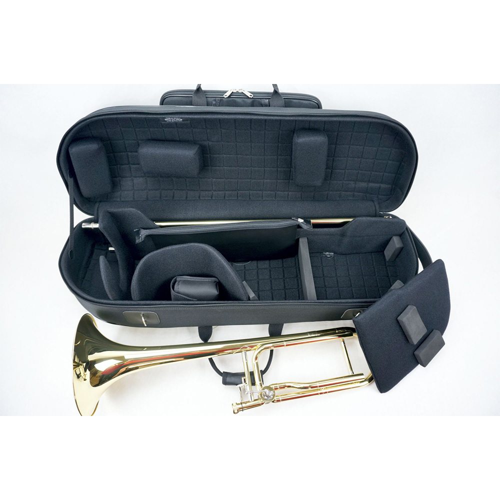 Compact Marcus Bonna Tenor Trombone Case - open with the compartments open and showing and a trombone next to it
