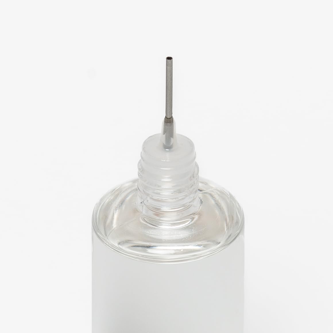 A close up of the precision applicator tip of the monster oil classic rotor oil heavy bottle