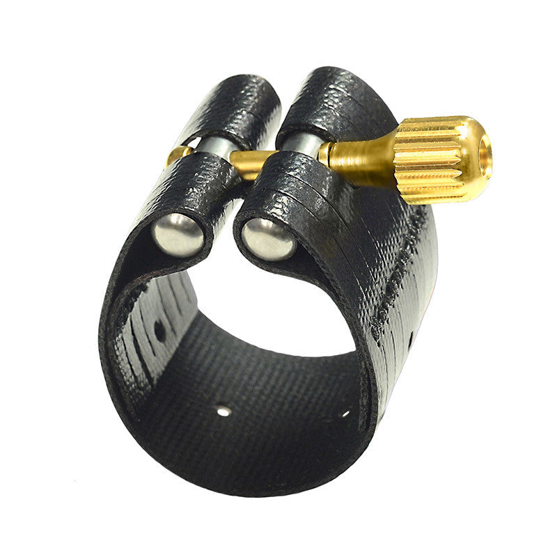 The Rovner Dark 3R Baritone saxophone ligature. A leathered cloth material with a brass screw for tightening.