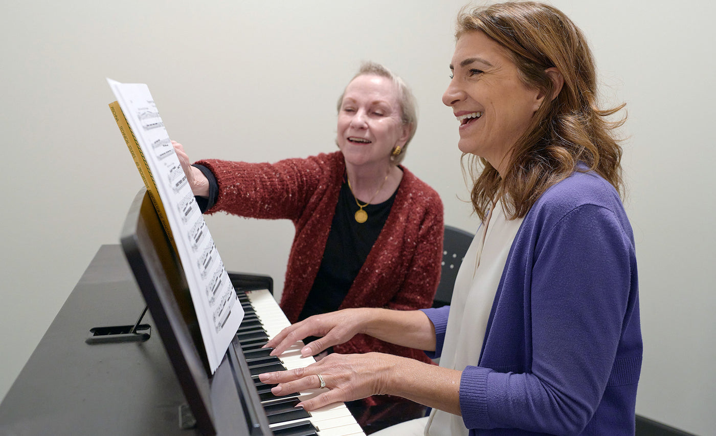 Sue and Elizabeth having a piano lesson