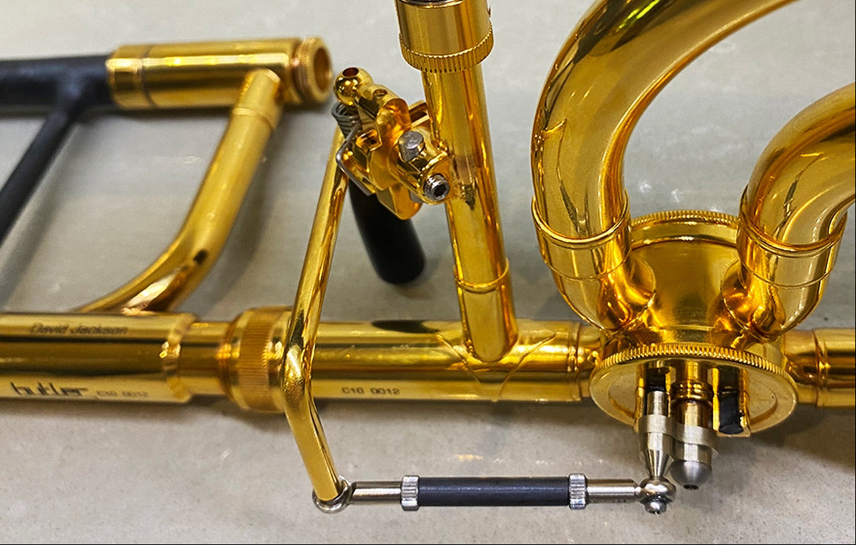 Butler C10 Large Bore Tenor Trombone - close up of bell brace and valve trigger