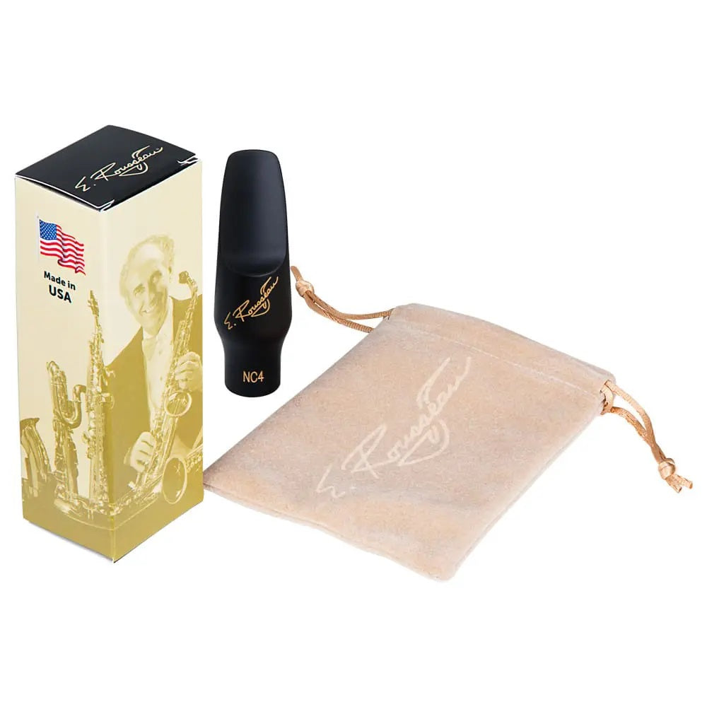 The Eugene Rousseau New Classic Alto Sax Mouthpiece sitting next to its packagin box and its felt pouch.