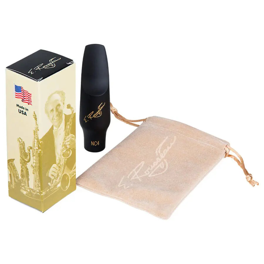 The Eugene Rousseau New Classic Tenor Sax Mouthpiece sitting next to its packagin box and its felt pouch.