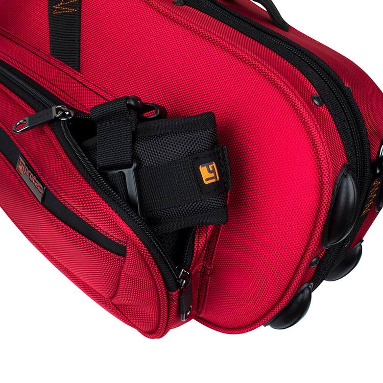 The Protect BPSTRAP backpack strap - folded up, partially placed in a pocket of a protec case