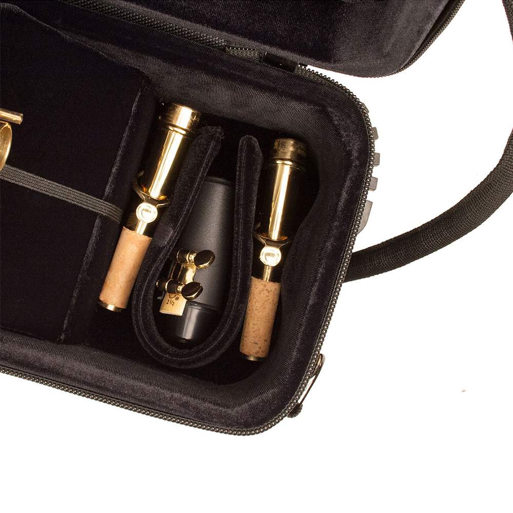 A close up on the neck piece pocket, with neck pieces in it, of the Protec Propac PB310 case