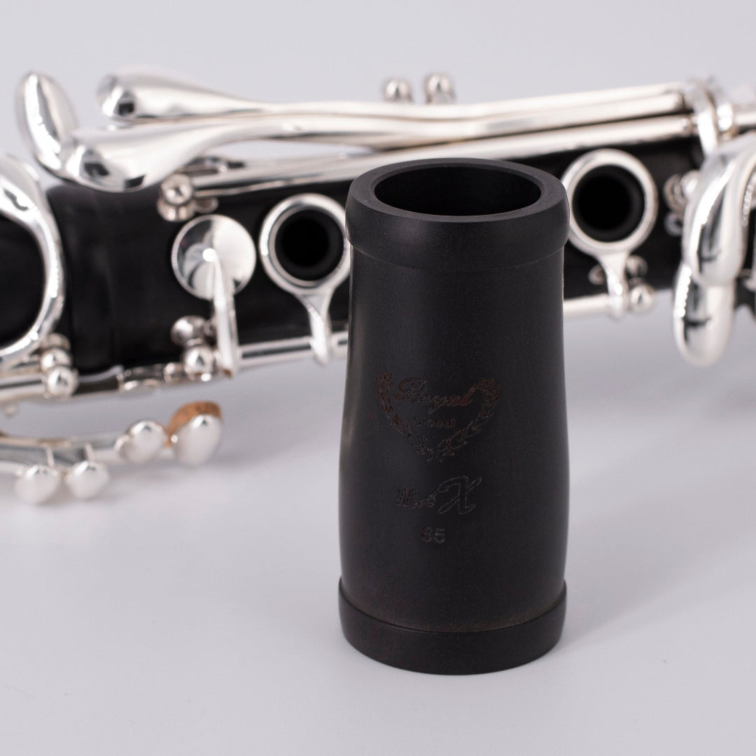 Royal Global Max Bb Clarinet - close up on the barrel sitting in front of the clarinet that's laying down