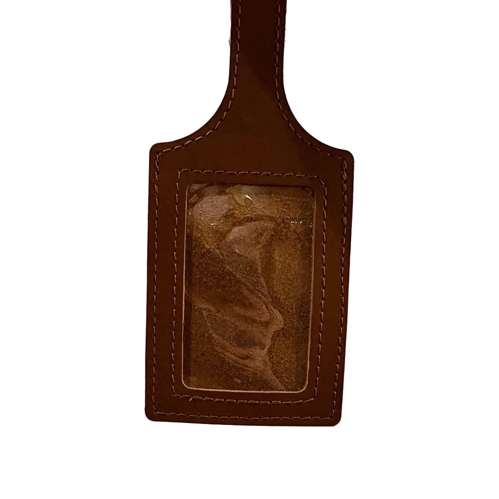 Close up of window side of the Sax Shop leather luggage tag