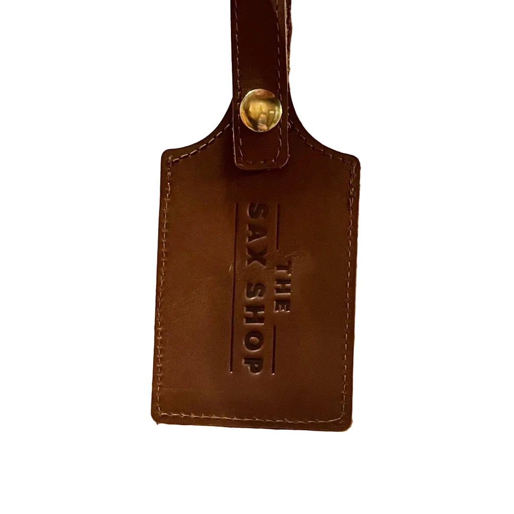 Up close view of the Sax Shop leather luggage tag
