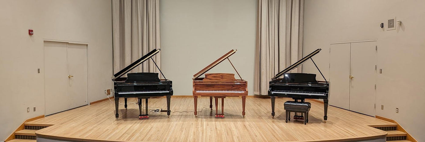 Grand pianos in auditorium, pianos for sale