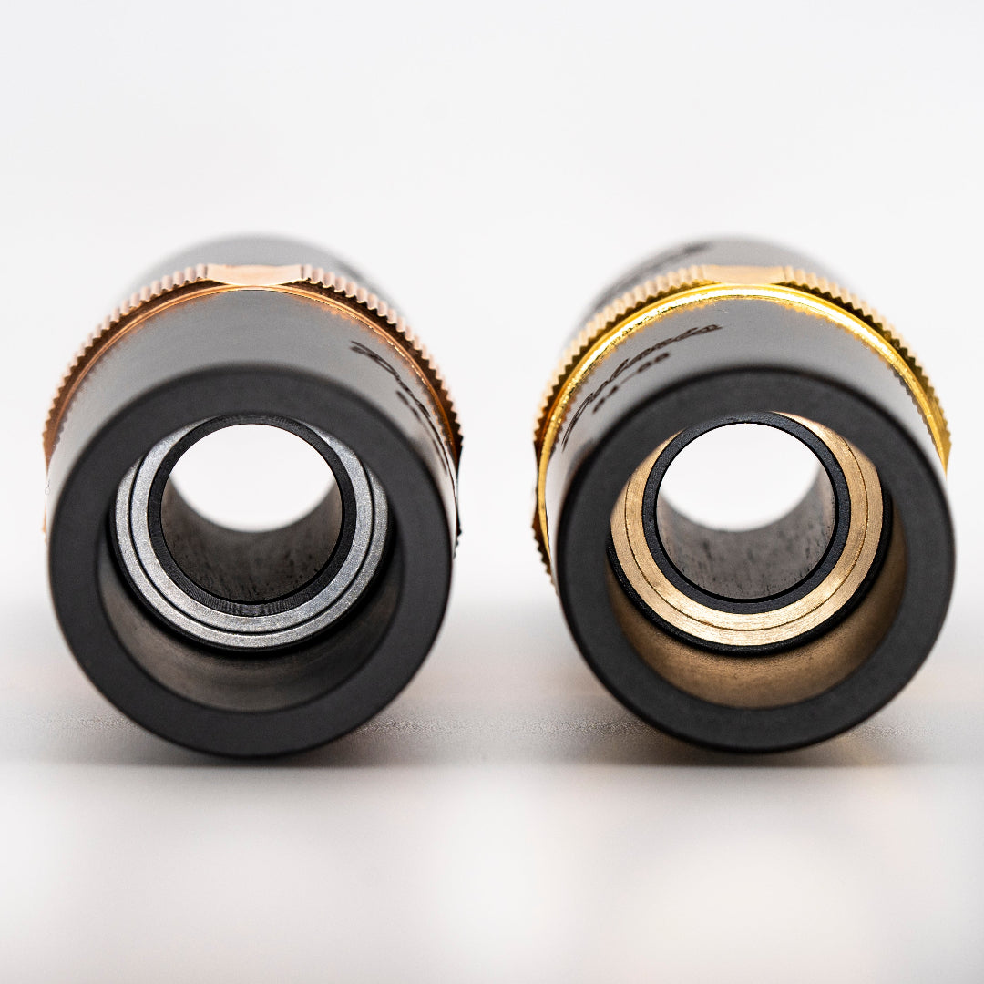 Two Adjustable Clarinet Barrles on their side. 