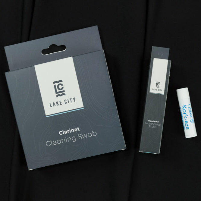 The Lake City Clarinet Bundle. Includes a clarinet cleaning swab, a mouthpiece brush, and a tube of cork grease. 