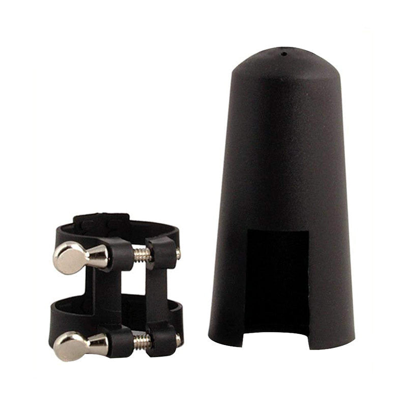 Plastic Luyben ligature with metal screws, and the plastic mouthpiece cap