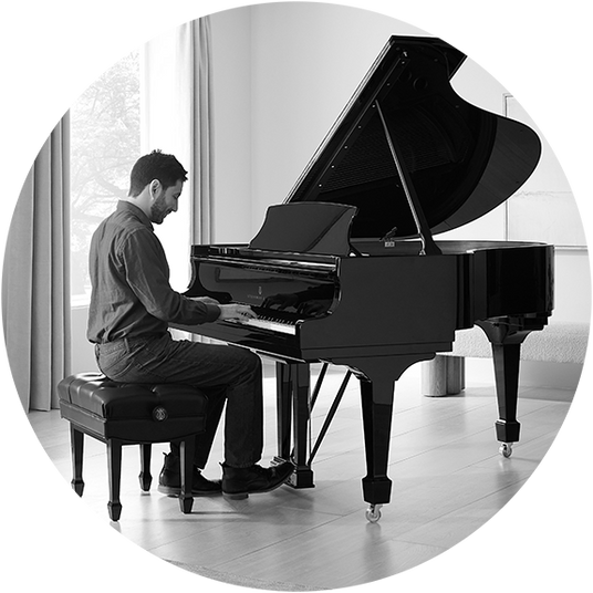 Someone playing on a grand piano