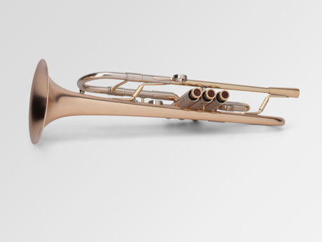 Adams A4 Bb Trumpet - laying down sideways with valves in front 
