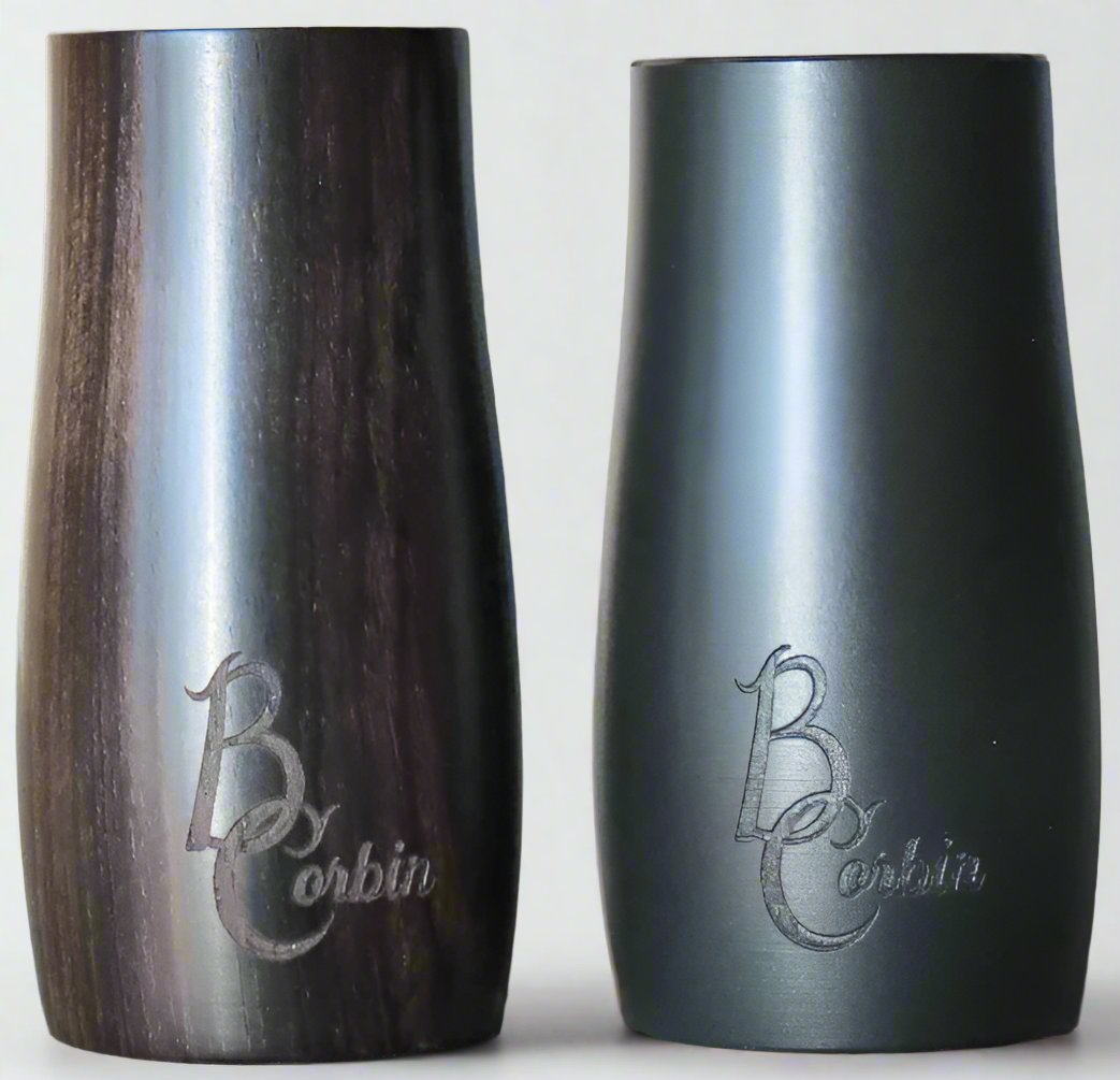 A synthetic and a grenadilla wood B. Corbin Traditional Barrel sitting next to each other.