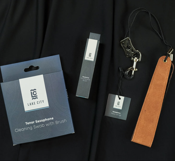 The Lake City Tenor Sax Bundle - Includes a swab, mouthpiece brush, and a neck strap, all of which are Lake City Brand products.